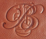 debossed monogram on British tan leather